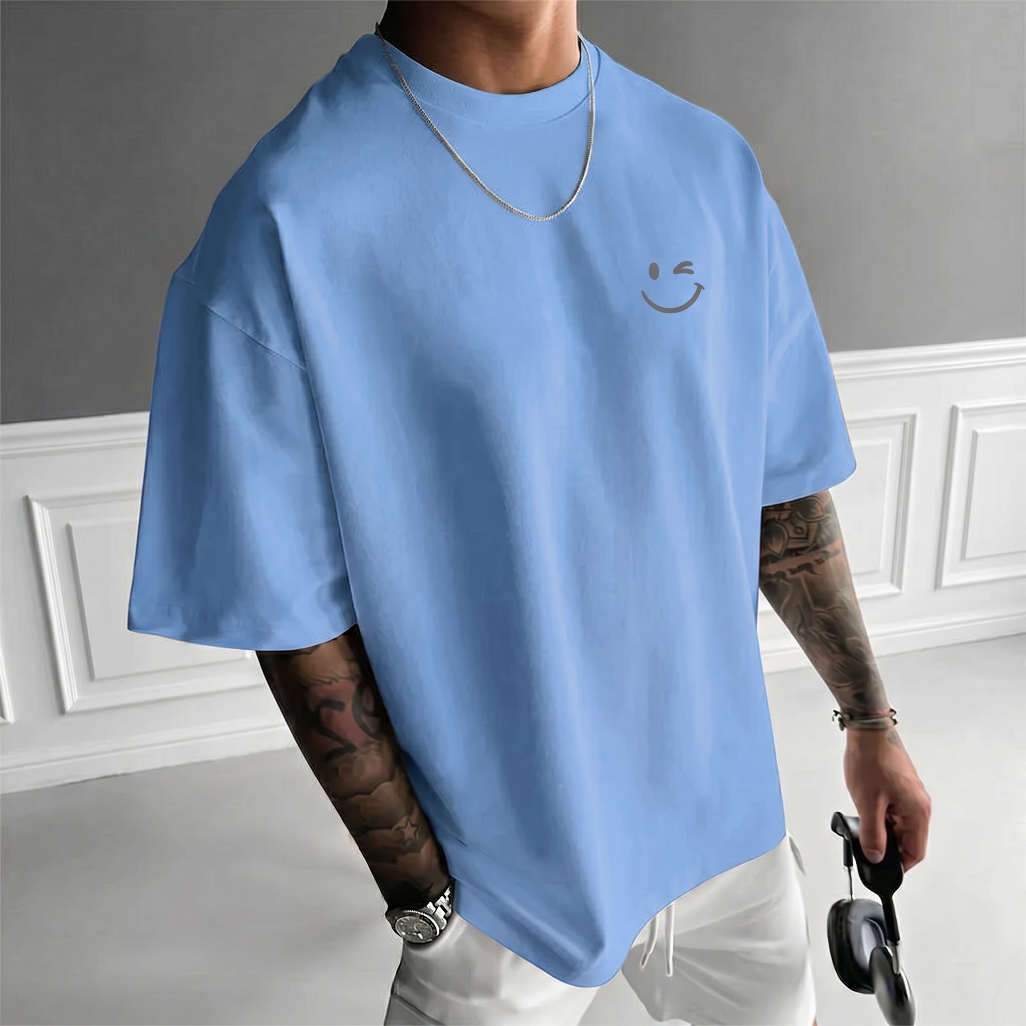 Camiseta urbana para hombre de corte holgado – algodón 100% premium, ajuste oversize casual y estampado tipográfico.